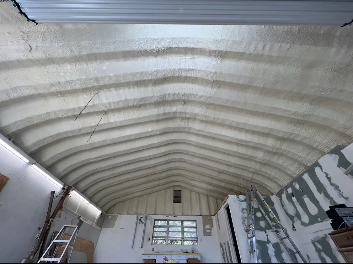 Spray polyurethane foam applied to the underside of a metal roof deck in Redding